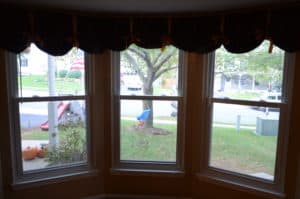 A front yard view through newly added bay windows. Chris & Karen Highland