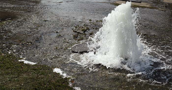 A water main leak can cause small bursts in your yard and on the street.