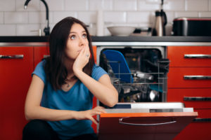 woman with her broken dishwasher